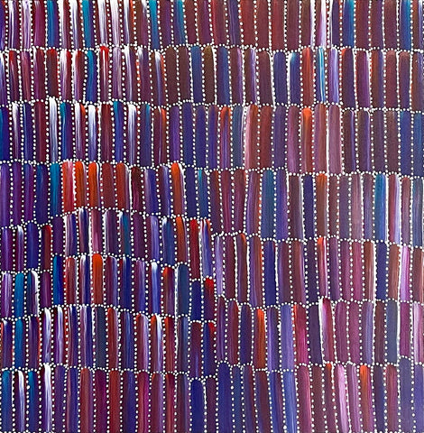 A detailed close-up of an acrylic painting on primed linen by Jeannie Mills Pwerle, featuring a patterned representation of Anaty (bush yam).