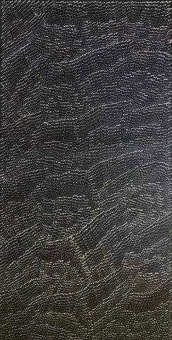 A painting by Lily Kelly Napangardi, featuring intricate white dots on a black canvas, representing the desert sandhills or tali.