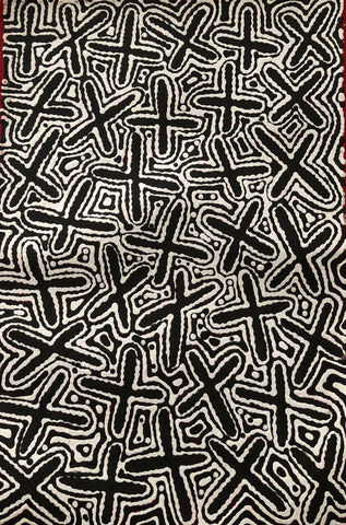 A canvas painting featuring abstract black and white patterns representing the 'Budgerigar Dreaming' with Concentric circles and cross-like shapes.