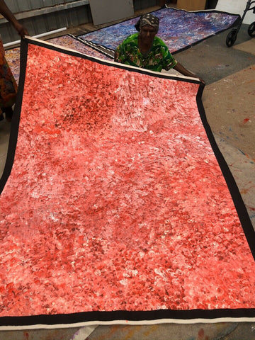 A 150x200cm painting featuring an abstract pattern of orange tones, representing the 'Bush Plum Dreaming' artwork by Polly Ngale.