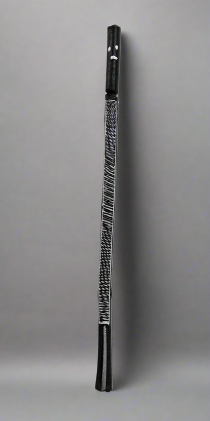 Black and white Mimih Spirit wooden sculpture by Kayleen Namundja.