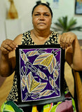 Artist Christine Burarrwanga holding her painting depicting a stingray and fish with traditional rarrk patterns on a purple background.