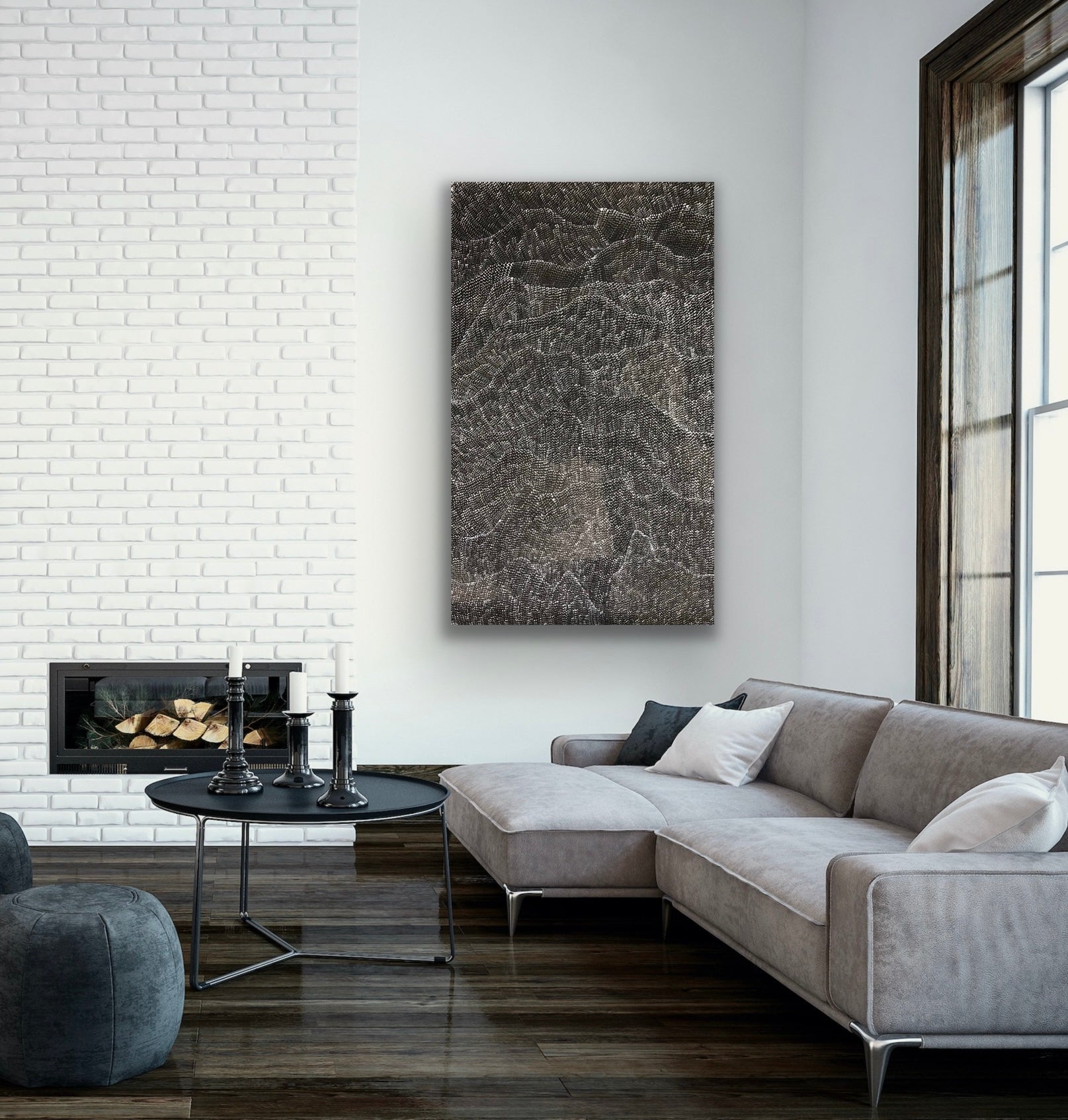 A painting by Lily Kelly Napangardi, featuring intricate white dots on a black canvas, representing the desert sandhills or tali.
