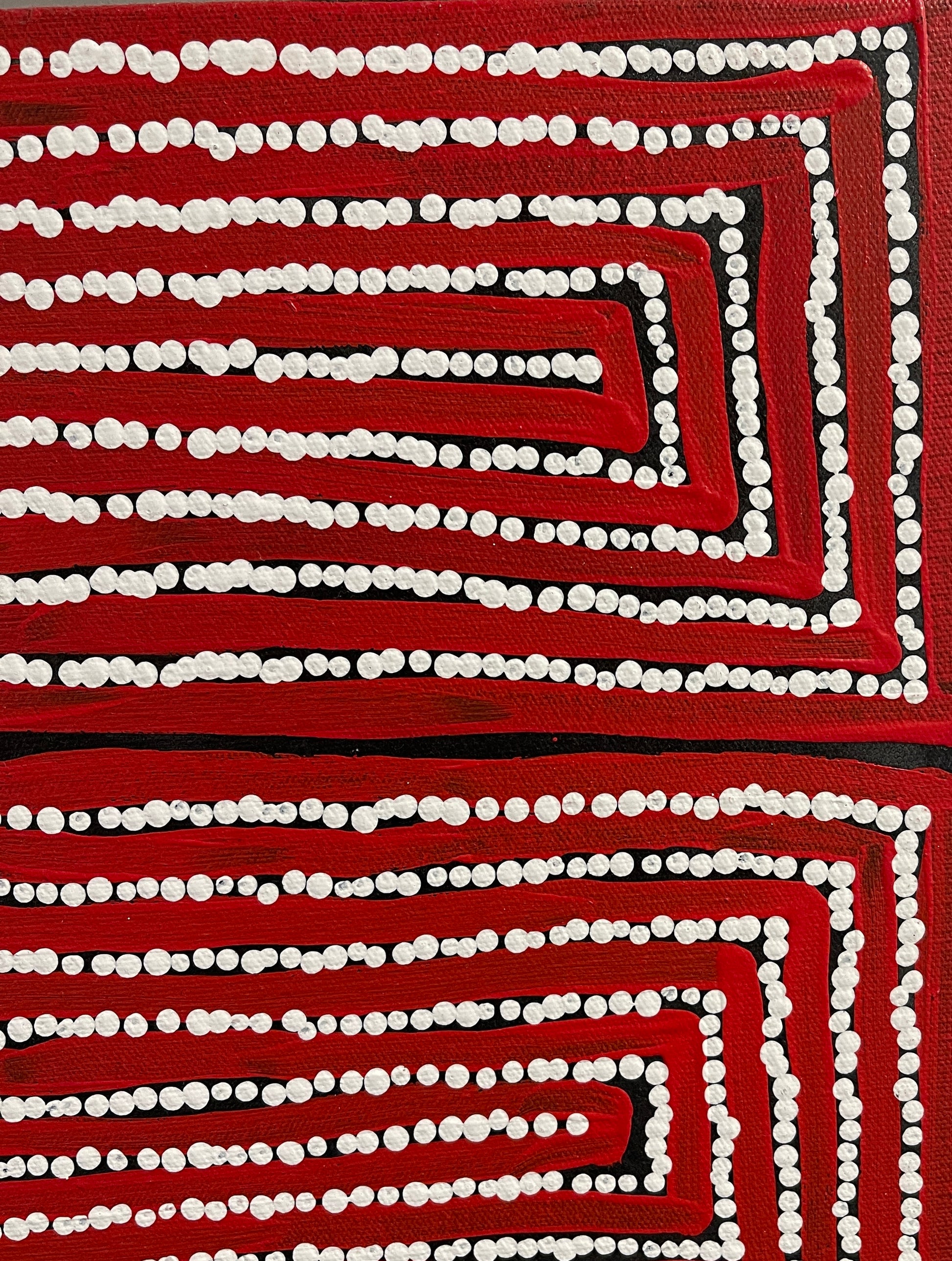 Close-up of a painting by Thomas Tjapaltjarri.