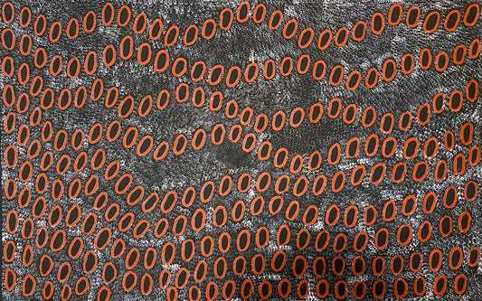 A painting by Ngoia Pollard Napalptjarri showing red oval shapes on a white dotted black background.