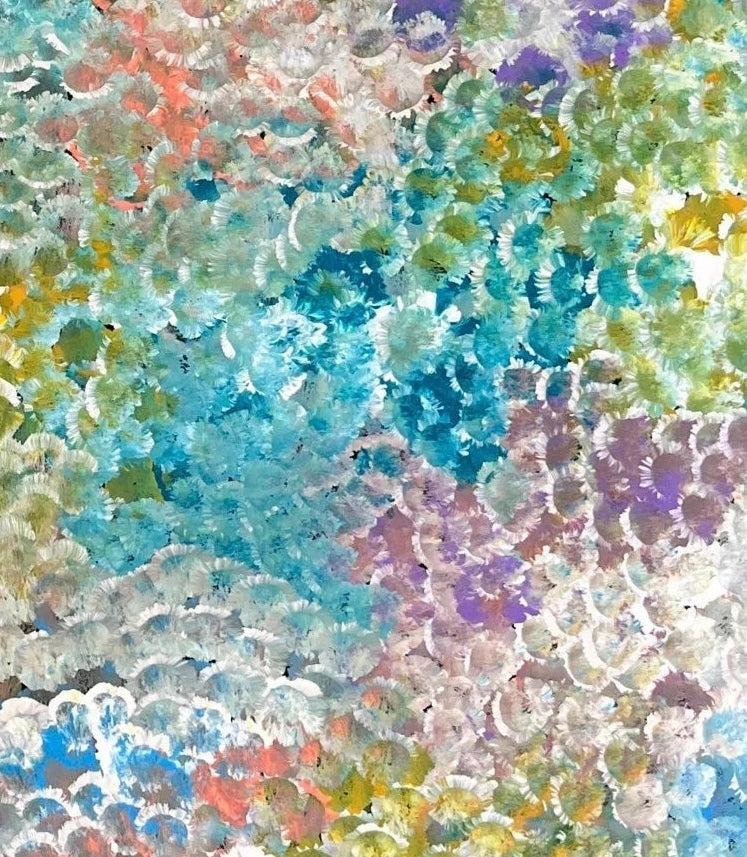 a close-up of Belinda Golder Kngwarreye's 'Bush Plum Dreaming' artwork, showing a detailed pattern of dots in various colours.