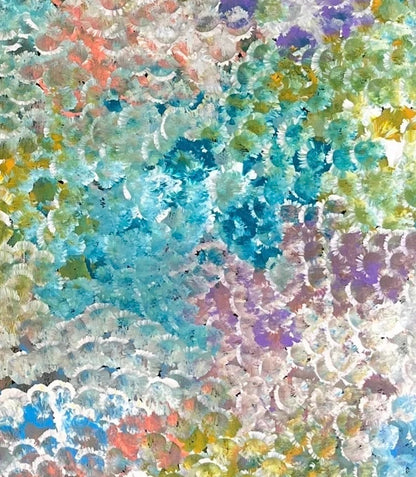a close-up of Belinda Golder Kngwarreye's 'Bush Plum Dreaming' artwork, showing a detailed pattern of dots in various colours.