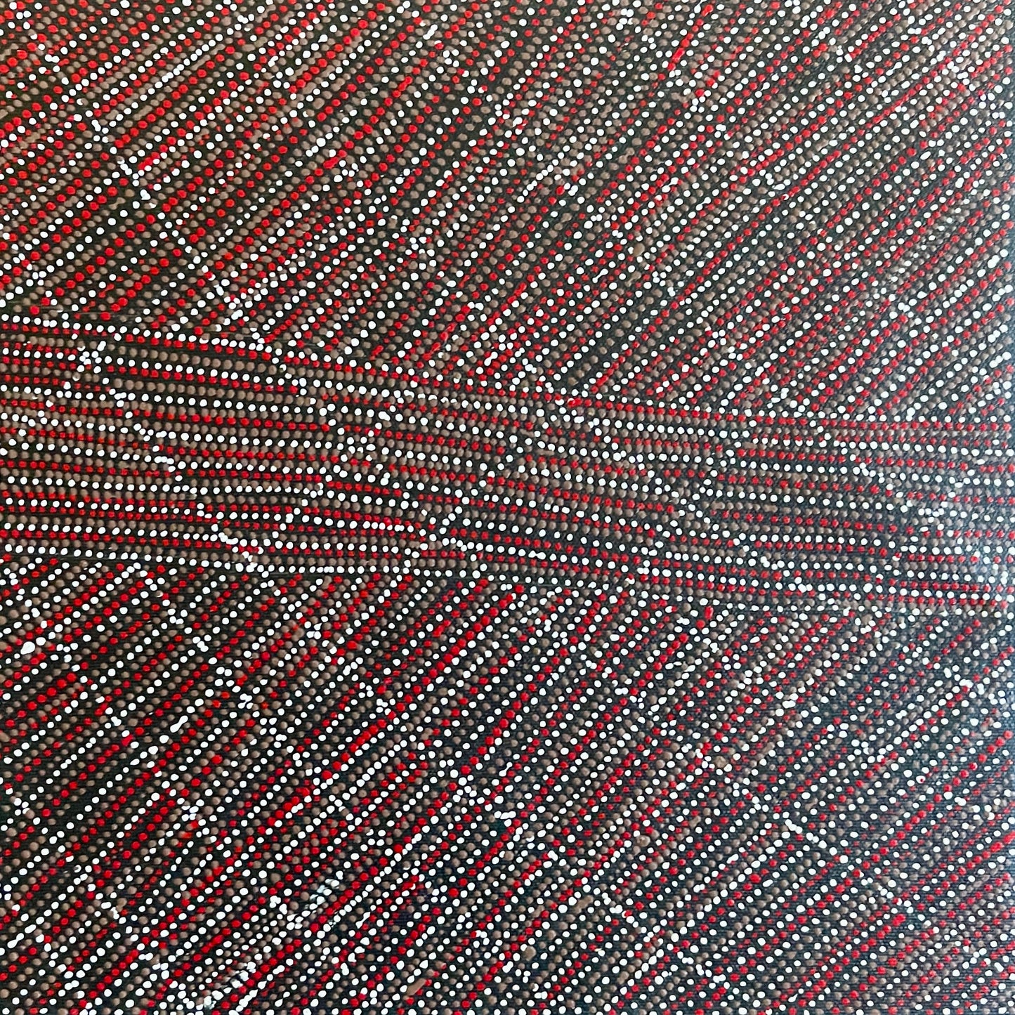 A 30x30cm painting by Lizzie Moss Pwerle with a geometric pattern featuring red, grey and white dots on a black background. 