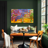 A painting by Lorna Fencer Napurrula depicting yarla or bush potato dreaming on a green wall above a bench with a table and chairs.