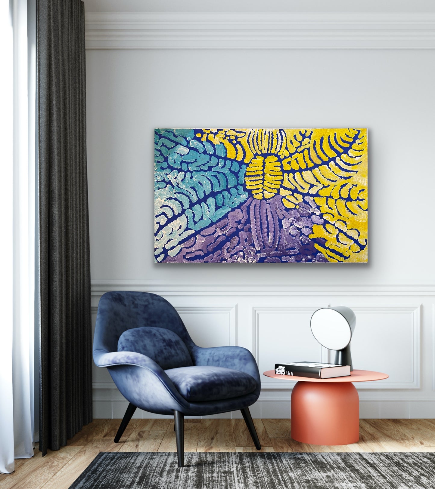 A painting by Lorna Fencer Napurrula depicting yarla or bush potato dreaming hanging in a modern interior with a blue armchair and orange side table.