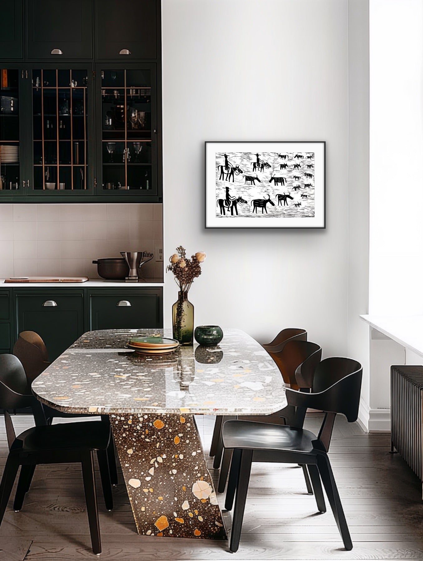 Framed black and white linocut print by Jill Daniels in Dining area with a marble table and black chairs, featuring a framed artwork on the wall.