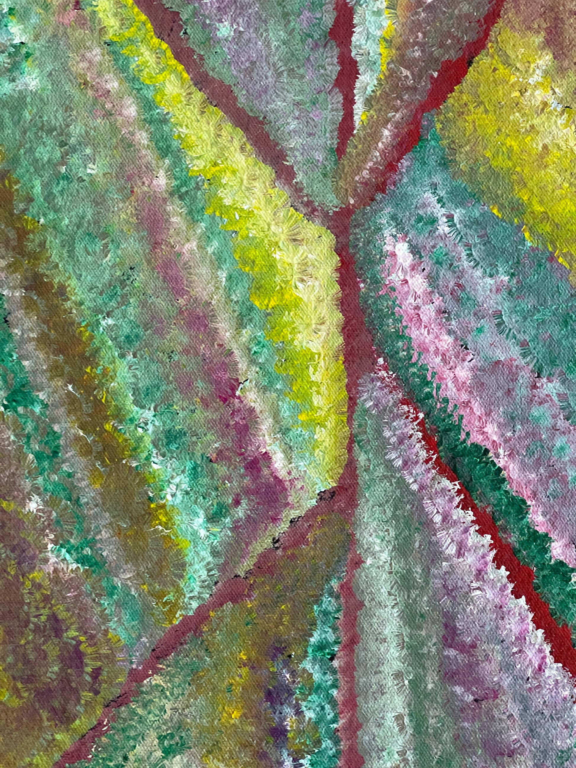 Close-up of a colourful painting by Mary Morton Kemarre with geometric patterns in green, purple, red and yellow.