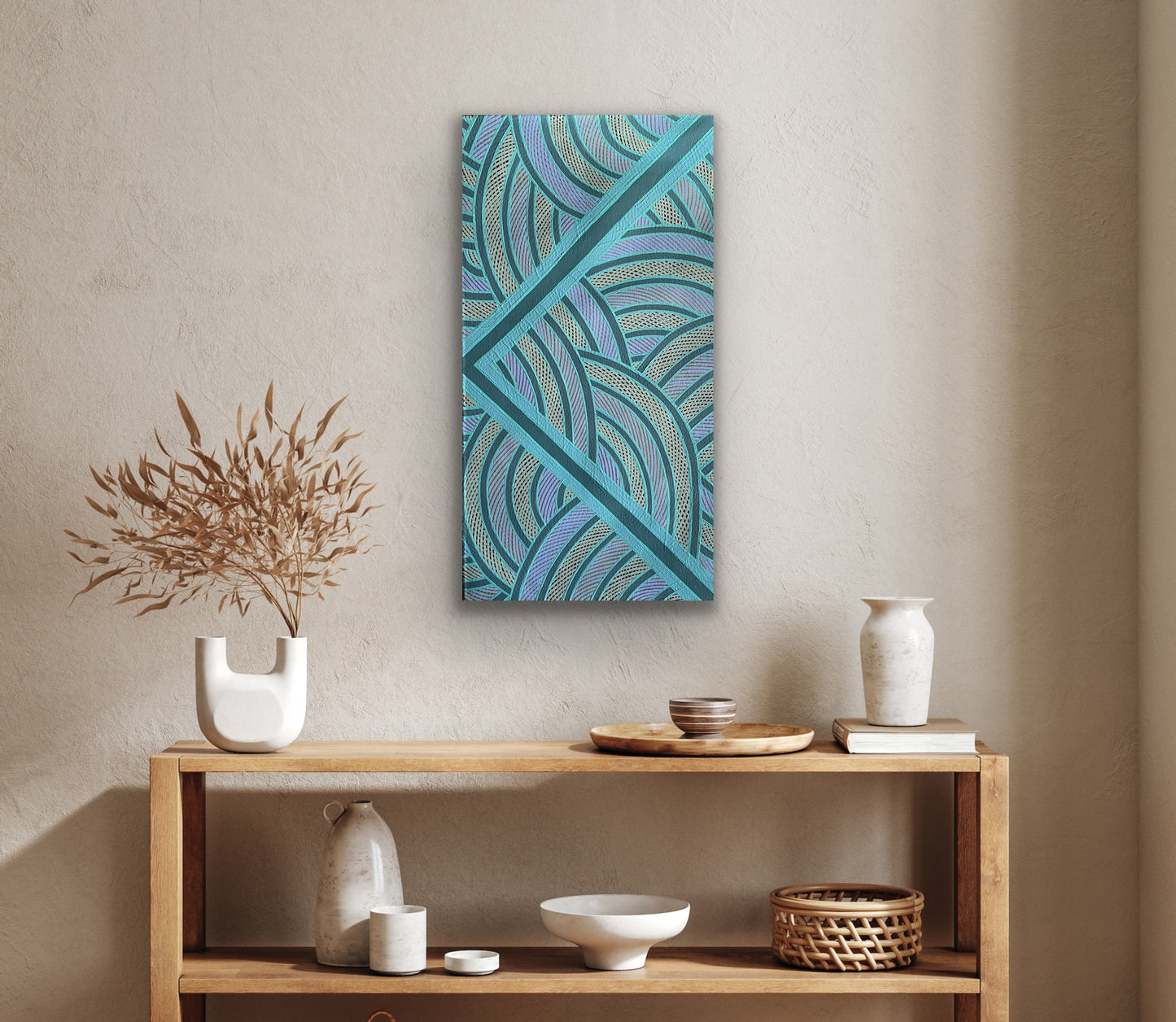 A painting by Ruby Djikarra Alderton hanging above a wooden shelf with various decorative items.