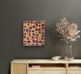 A 42x36cm painting Abie Loy Kemarre hanging on a wall above a wooden console table with decorative items.