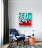 Modern interior with a blue armchair, orange side table, and painting by Aboriginal artist Mitjili Naparrula hanging on the wall.