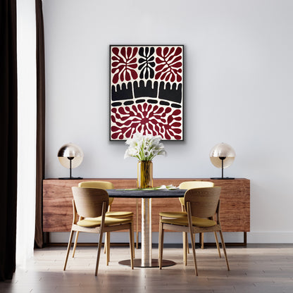 A 90x120cm painting by Aboriginal artist Mitjili Naparrula hanging in a dining room with a table and chairs, a wooden sideboard.