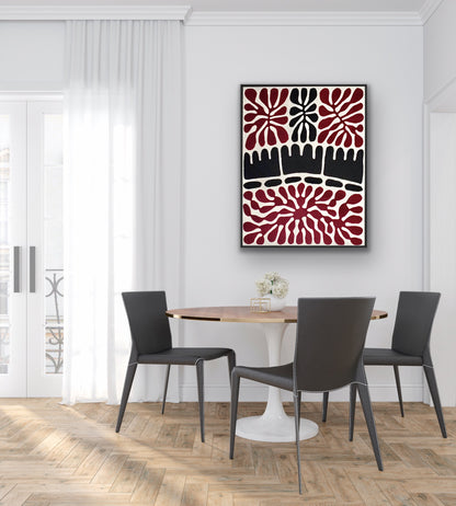 Dining room with a wooden table and black chairs, featuring a painting by Aboriginal artist Mitjili Naparrula in Maroon, black and white.