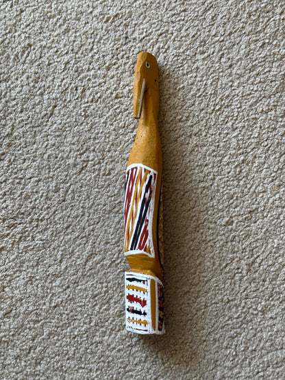 Painted milkwood bird carving by Aboriginal artist Christine Burarrwanga.
