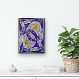Artwork by Christine Burarrwanga depicting a stingray and fish with traditional rarrk patterns on a purple background hanging on a white wall with a plant and decorative items below.