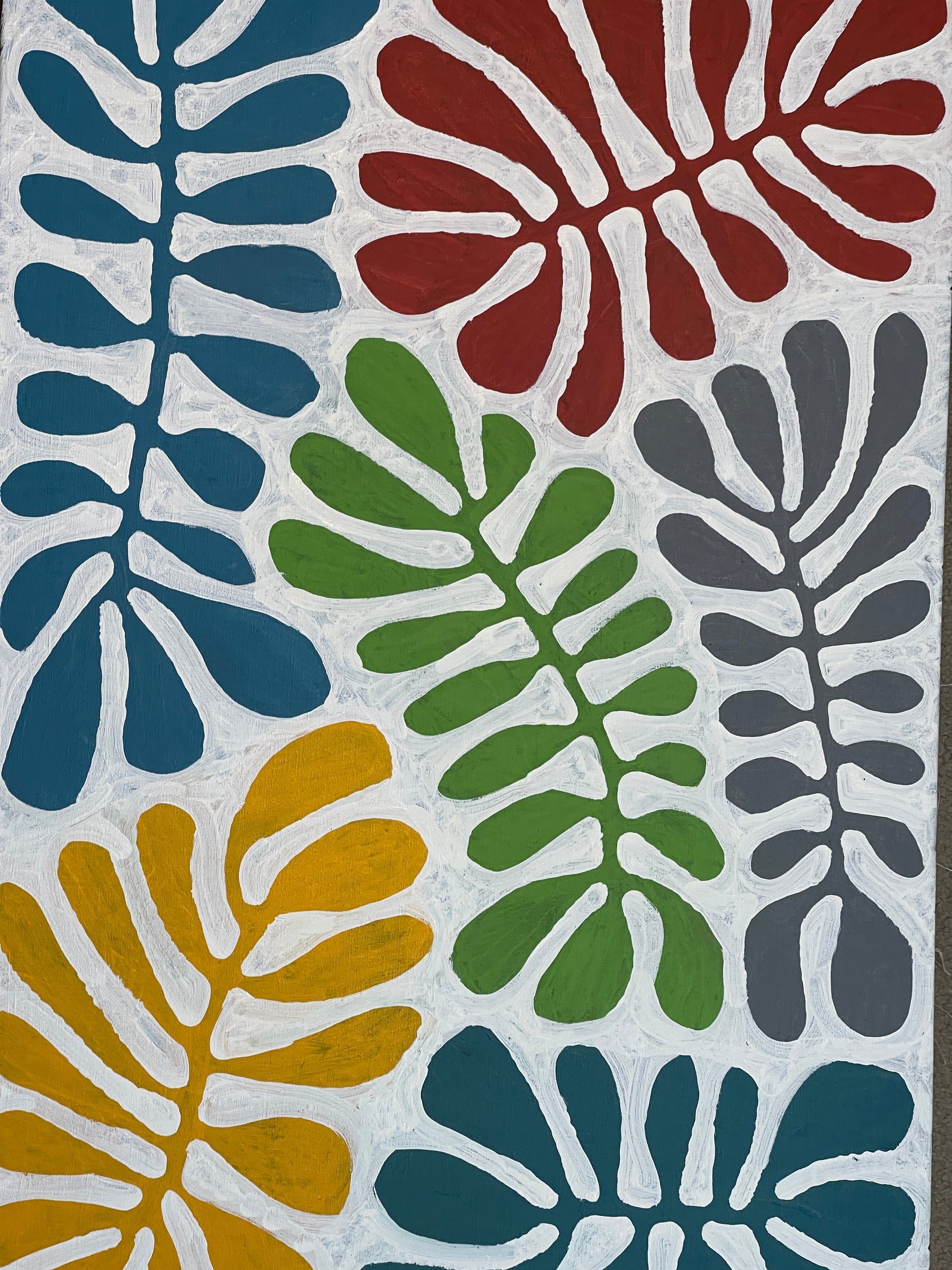close-up look at a painting by Aboriginal artist Mitjili Naparrula.