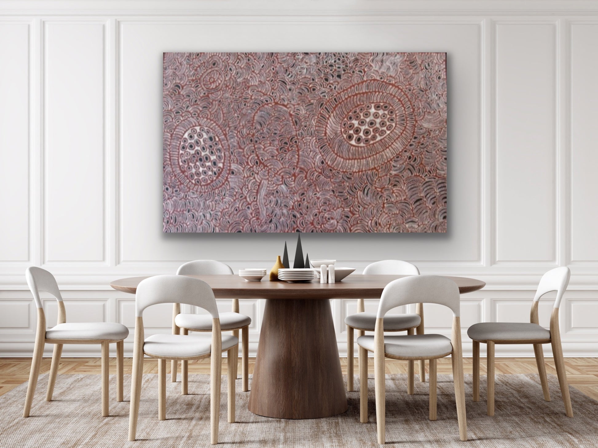 Dining room with a large painting by Tjawina Porter Nampitjinpa on the wall.