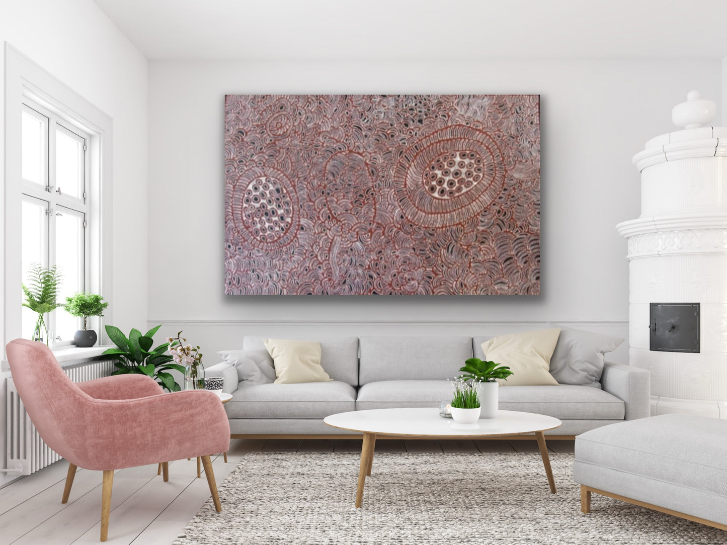 A painting by Tjawina Porter Nampitjinpa in maroon, white and black colours hanging in a modern living room.