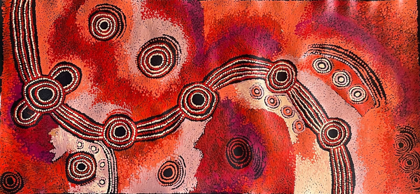 A canvas painting by Teresa Baker featuring abstract geometric patterns with predominantly red and black colors, representing the creation story of Minyma Malilu Tjukurrpa.