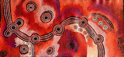 A canvas painting by Teresa Baker featuring abstract geometric patterns with predominantly red and black colors, representing the creation story of Minyma Malilu Tjukurrpa.