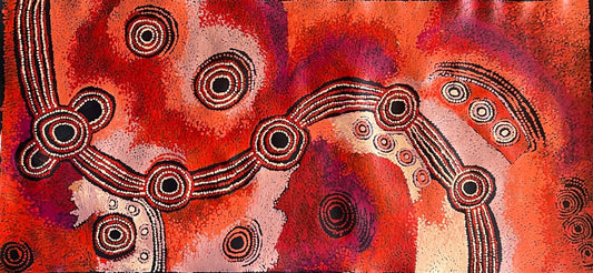 A canvas painting by Teresa Baker featuring abstract geometric patterns with predominantly red and black colors, representing the creation story of Minyma Malilu Tjukurrpa.