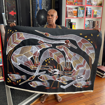 Eddie Blitner holding his 'Billabong Scene' painting 95x147cm