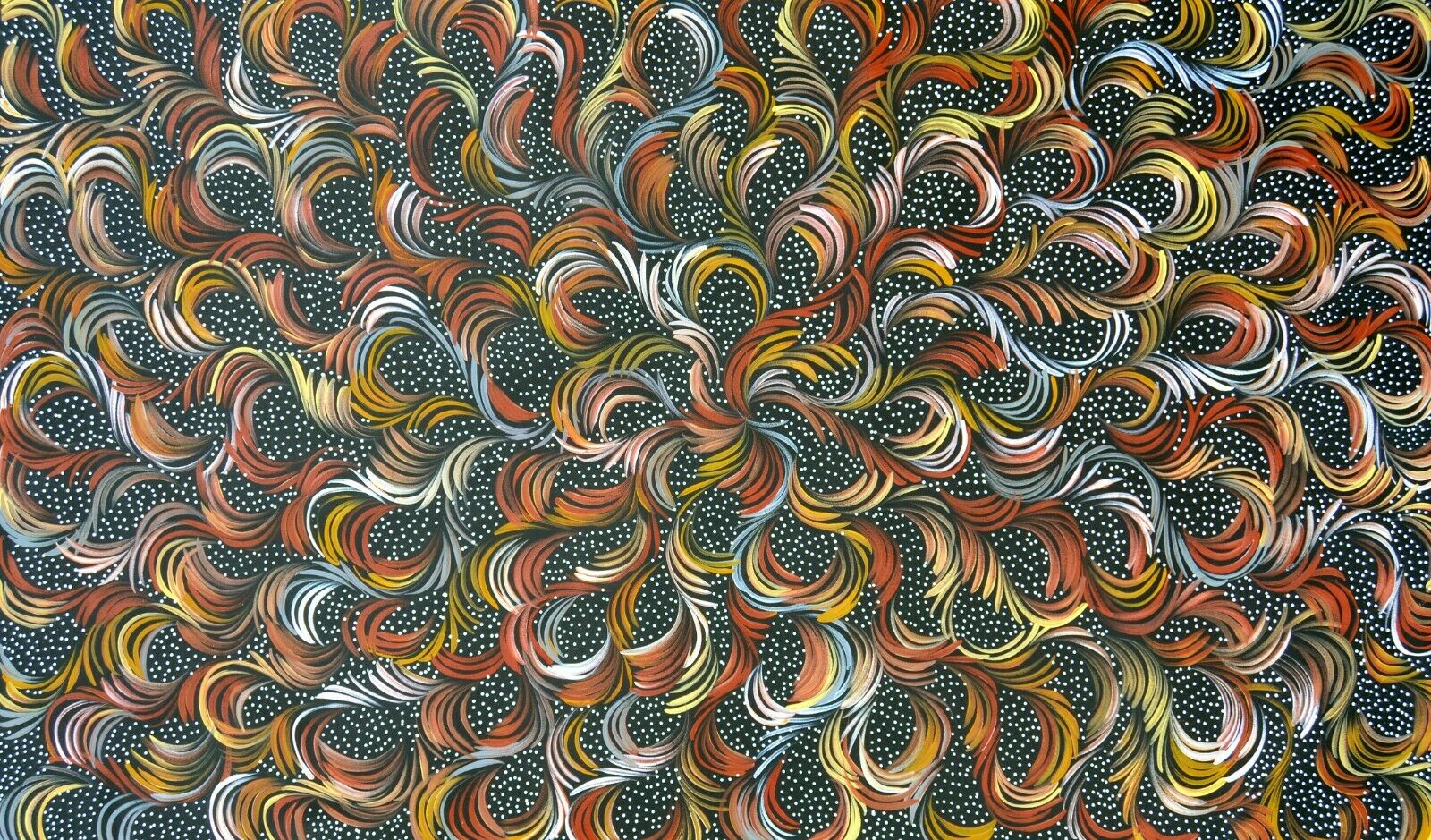A canvas painting by Selina Numina featuring a geometric pattern with swirling lines in a variety of colors.