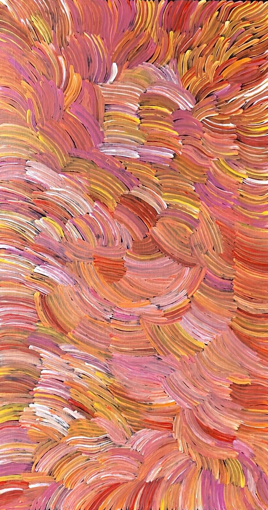 A pencil yam painting by Jedda Purvis Kngwarreye featuring swirling patterns in pink, red, yellow and orange hues.