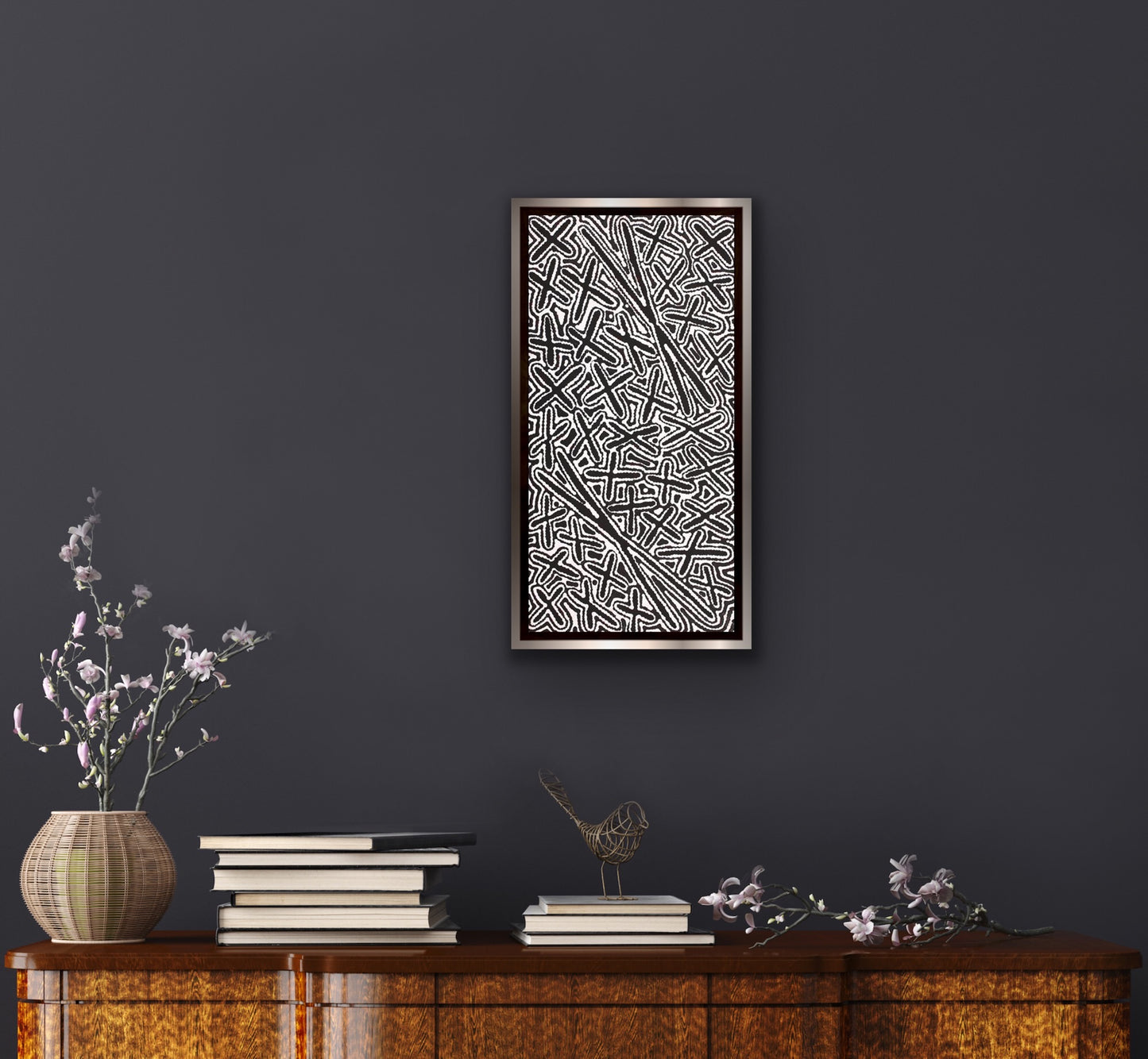 A silver framed Kenneth Jungarrayi Martin 'Budgerigar Dreaming' painting in modern apartment decor