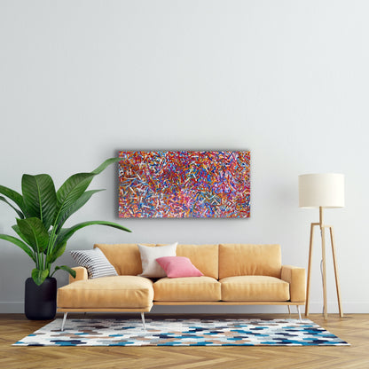 A painting by Betty Club Mbitjana hanging on a wall above a modern couch, plant and lamp.