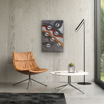 A 'My Country' painting by Delvine Pitjara 90x60cm White Black Red Orange hanging on the wall above a modern brown leather chair, coffee table and lamp.