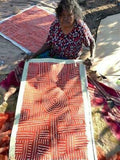 Bambatu Napangardi holding her 'Kungka Tjukurrpa' painting, 60x90cm