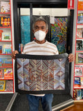 Eddie Blitner holding his 'Mimi Spirits' painting 36x51cm