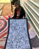 Betty Club Mbitjana holding her My Mother's Dreaming painting 60x90cm Black White Grey