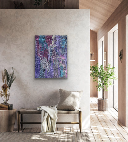 A painting by Meredith Curley featuring a pattern of swirling circles in various shades of blue, purple, pink and white on a black background in a modern retail waiting area. 