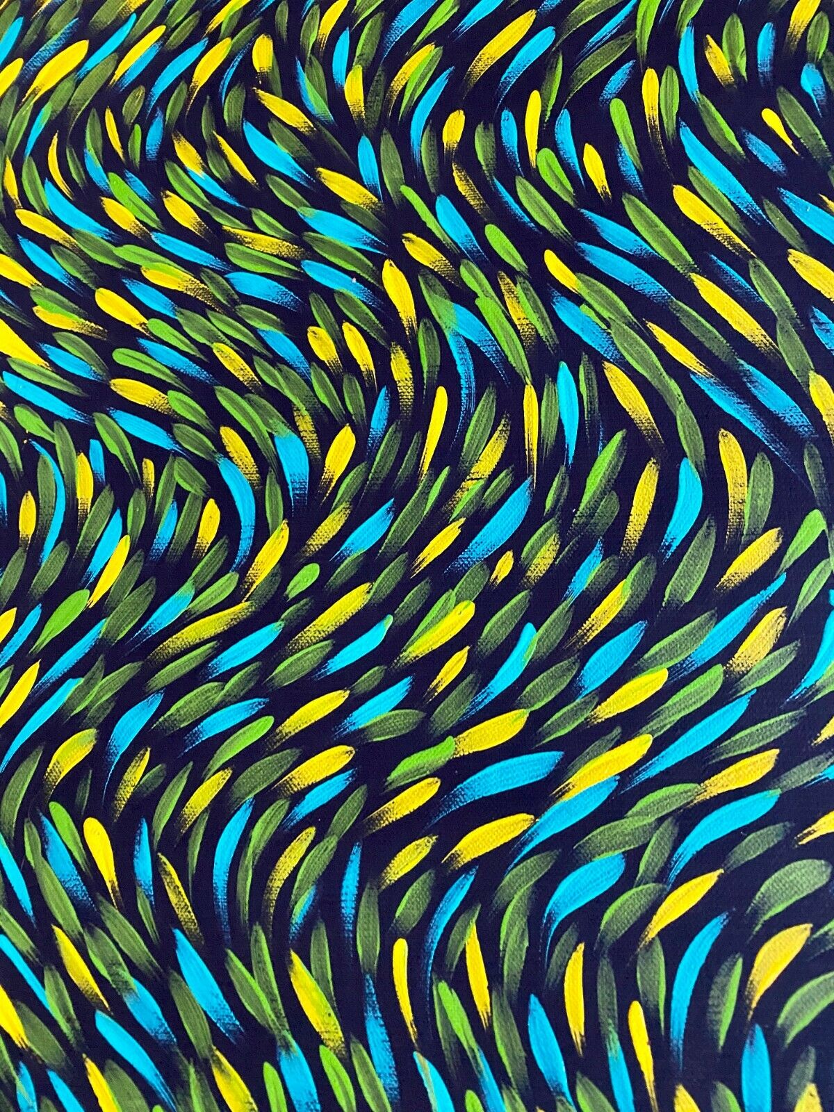 Close-up of a painting by Gloria Petyarre featuring bush medicine leaves in green, aqua and yellow and on a black primed linen canvas.