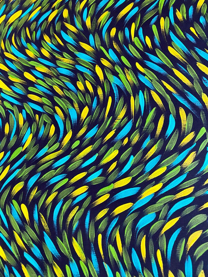 Close-up of a painting by Gloria Petyarre featuring bush medicine leaves in green, aqua and yellow and on a black primed linen canvas.