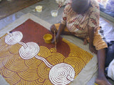 Gail Napangardi painting her 'Bush Onion Dreaming' painting 90x120cm