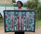 Colleen Wallace Nungarrayi holding her 'Dreamtime Sisters' painting 60x90cm