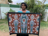 Colleen Wallace Nungarrayi holding her 'Dreamtime Sisters' painting 60x90cm