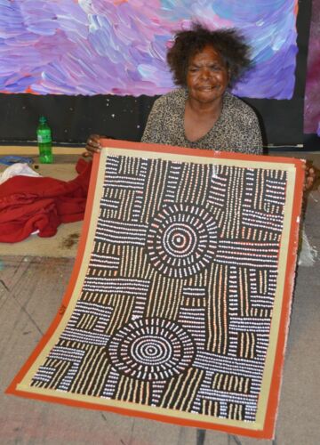 Bambatu Napangardi holding her 'Kungka Tjukurrpa' painting, 60x90cm